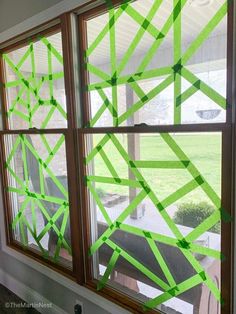 some green tape is taped to the window