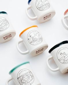 six coffee mugs with different designs on them