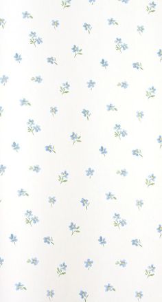 a white wall with blue flowers on it