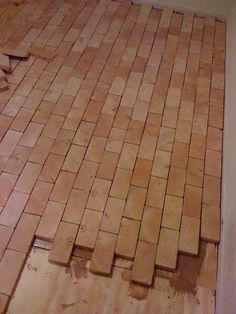 a bathroom floor that is being remodeled with wood planks on the floor and tile