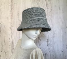 Crocheted grey raffia hat It is a classic accessory for sun protection, summer parties, beach and travel. The hat is crocheted from natural raffia, light, elastic, small fields of the hat are reinforced with wire. The hat keeps its shape well and does not fade in the sun. The cap is soft to the touch, slightly rough. It is fully crocheted. Easy to carry with foldable design. The hat is perfect for summer wardrobe. Field Size: about 2,7 inches (7 cm) Care of the product:        It is better to dry the hat naturally, without using additional heating sources. When the raffia product dries, it returns to its original shape.        You cannot wash them in the usual way. If it gets dirty, clean it with soapy water and a sponge. The surface is gently wiped and left to dry in the shade. Items shou Adjustable Wide Brim Gray Bucket Hat, Adjustable Gray Bucket Hat With Curved Brim, Gray Wide Brim Adjustable Bucket Hat, Gray Short Brim Hat For Spring, Adjustable Gray Bucket Hat, Gray Short Brim Spring Hat, Gray Hat With Short Brim For Spring, Gray Curved Brim Bucket Hat For Summer, Gray Curved Brim Hat For Spring