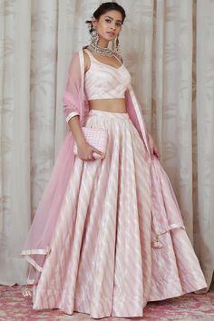 Featuring a light pink lehenga in cotton satin and net base. It is paired with a matching blouse and a zardosi embroidered dupatta.  FIT: Fitted at bust and waist. COMPOSITION: Brocade silk, Net. CARE: Dry clean only. Lehga Choli, Light Pink Lehenga, Crop Top Outfits Indian, Drape Dupatta, Lehenga Simple, Traditional Dresses Indian, Pink Brocade, Haldi Outfits