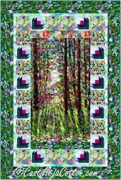 a green and white quilt with trees in the background, surrounded by colorful flowers on it