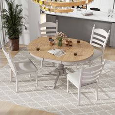 a kitchen table with four chairs around it