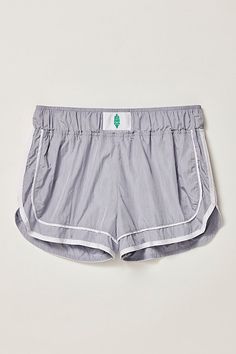 A twist on a sporty classic, these quick-drying shorts feature bold piping details and embroidery to elevate your run. **Fit:** Pull-on style mid-rise shorts; fitted waist and relaxed bottom **Features:** Durable ripstop, water resistant outer fabric with subtle crinkle texture; quick-drying built-in brief; welt pocket to fit cards or keys **Why We ❤ It:** These shorts offer easy comfort and feature hard-working materials that keep you comfortable when you’re out in the elements. | Varsity Blues Varsity Blues, Free People Shorts, Mid Rise Shorts, Hard Working, Fp Movement, Small Waist, Blue Shorts, Welt Pocket, Boho Outfits