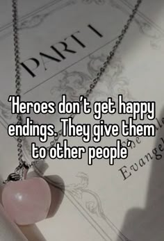 a heart shaped necklace with the words'hero don't get happy endings they give