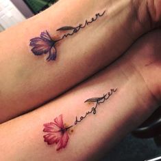 two women with matching tattoos on their legs, one has a flower and the other has a name