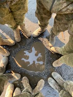 several soldiers standing in a circle with their feet on the ground