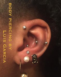 a person with some piercings on their ear