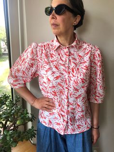 Vintage 80s white and red abstract print short sleeve blouse. Puff sleeve front buttoned blouse. Collared blouse. Summer women's outfit. Cotton colourful blouse. Marked as size 40. 100% cotton. From shoulder to shoulder 15,5" 39cm Bust 40" 102cm Sleeve length 15" 38cm Length 24" 61cm. Trendy Fitted Button-up Shirt, Summer Slim Fit Buttoned Tops, Summer Slim Fit Tops With Button Closure, Slim Fit Tops With Button Closure For Summer, Summer Slim Fit Button-up Tops, Slim Fit Button-up Tops For Summer, Trendy Fitted Blouse With Puff Sleeves, Stretch Summer Shirt With Button Closure, Fitted Summer Shirt With Button Closure