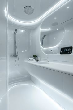 a modern bathroom with white walls and flooring is lit up by leds on the shower head