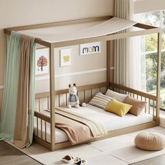 a child's bed with a canopy over it and pillows on the bottom floor