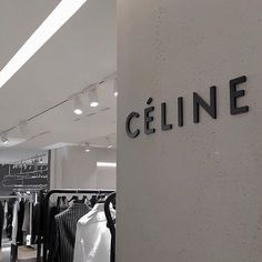 a clothing store with clothes hanging on racks