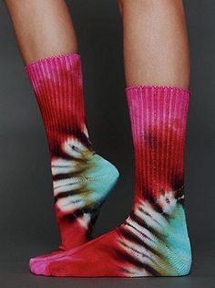 the legs and ankles of a person wearing socks with tie - dyed designs on them