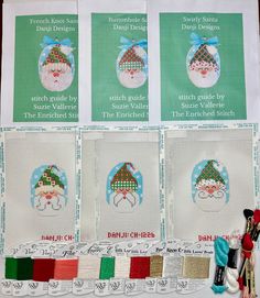 four cross stitch christmas cards with santa's hats on them