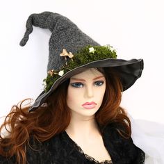 "The Hidden Key Garden Witch Hat is crocheted and then felted, creating the classic shape. A mossy hedge surrounds the base with little white flowers scattered around. Three mushrooms mark the entrance and the key rests nearby. Soft but still firm enough to hang on a hook or rest on your table. Felting makes this hat naturally water repellent. This hat is tall and shapeable. You can tuck in folds in the tip to create even more character. The crochet body allows for a soft stretchable fit that ge Witch Hat Felt, Mushroom Witch Hat, Fairy Well, Fairy Portal, Flower Witch, Mushroom Witch, Mermaid Witch, Felt Witch, Felt Witch Hat