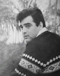 black and white photograph of a man wearing a sweater