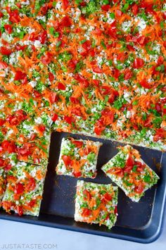 there are several pieces of food on the tray and one piece is cut into squares