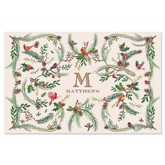 a christmas card with the letter m on it and holly branches, pine cones, and red berries