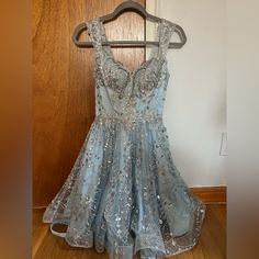 Stunning Light Blue Glittery Short Dress Only Worn For Two Hours For A Sweet 16 2nd Dress. It’s In Very Good Condition. The Back Has An Adjustable Corset. Can Be Used For A Quinceaera, Sweet 16 Or Homecoming. For Reference Im 5’5, 32a, And About A Size Small, However The Corset Can Adjust To A Bigger Bust And Size Medium. The Video Hasin Available For Any Offers! Short Party Dress, Light Blue Shorts, Big Bust, Book Decor, Sweet 16, Short Dress, Dresses Xs, Homecoming Dresses, Homecoming