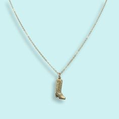 Gold cowgirl boot (or cowboy boot!) on a gold cable chain. Metal: 14kt gold-plated pendant, 14kt gold-filled chain Size: .75" long pendant Spring Clasp Available in 16", 18", and 20" chain (18" Fits Most) Nickel Free Made in the USA Cowgirl Boot, Cowboy Boot, Long Pendant, Gold Filled Chain, Cowgirl Boots, 14kt Gold, Cable Chain, Cowboy Boots, Gold Filled