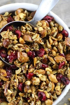 a bowl filled with granola on top of a table