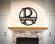 a fireplace with a sign that says roberts above it