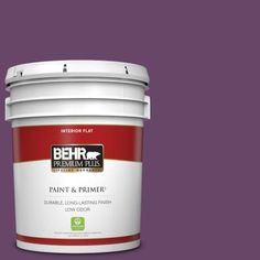 a paint can with the words behr paint and primer in one on an orange background