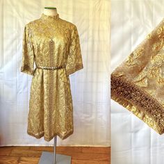 Sparkling 1960s, 1970s gold party dress. A layer of gold open brocade look netting with floral designs. Sheer from the bust line up and in the back. Wide ribbon trim in a darker gold that has cut glass golden rondels throughout. (Some have discolored, but not that noticeable in the shine and sparkle.)  The bottom layer, which is a gold lame type fabric: Bust is 36 inches Waist is 36 inches. Hips are 42 inches.  Length is 40 inches. Shoulder shoulder is 15 inches. 3/4 wide sleeve is 14 inches lon Gold Sequined Lace Dress, Vintage Gold Dress For Vintage Events, Festive Vintage Dresses For Vintage Events, Vintage Gold Dress For Evening, Fitted Gold Lace Dress, Vintage Gold Dresses For Evening, Vintage Gold Dress For Festive Occasion, Gold Vintage Dress For Festive Occasions, Vintage Gold Evening Dress