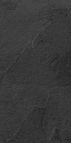 an image of a black surface that looks like stone