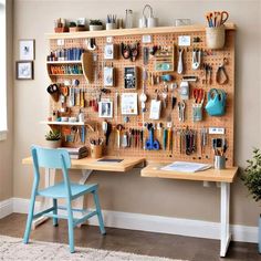 a wooden pegboard with lots of crafting supplies hanging on it's sides