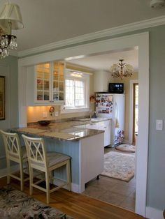 the kitchen is clean and ready to be used as a dining room or living room