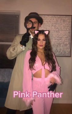 a man and woman dressed up as pink panther and catwoman for halloween costume party