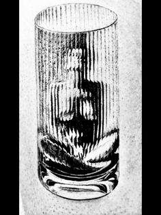 an old fashioned glass is shown in black and white, with lines on the bottom