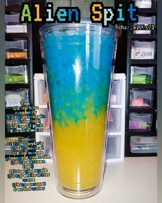 a blue and yellow drink sitting on top of a counter