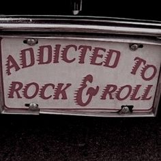 a sign that is on the side of a car saying, add to rock and roll