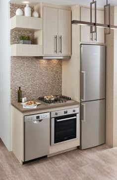 a kitchen with stainless steel appliances and wooden cabinets