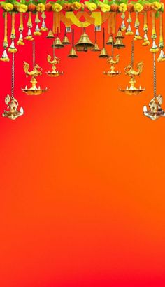 an orange background with many bells hanging from it