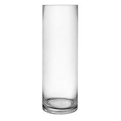 a tall glass vase sitting on top of a table