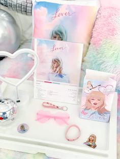 a white tray topped with lots of items on top of a table next to a pillow