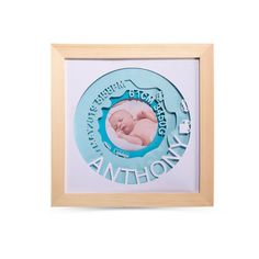 a baby's photo in a wooden frame with the words, birth month on it