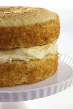 a close up of a cake on a plate with frosting and icing in the middle