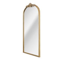 an ornate gold framed mirror on a white background