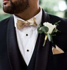 a man in a tuxedo with a boutonniere on his lapel