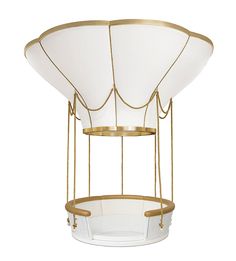 a white and gold chandelier with three lights hanging from it's sides