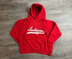 This listing is for a Vintage 90s era IU Indiana Hoosiers crewneck style sweatshirt.  Size tag states its a large. True vintage  Shorter fit length-wise!! Likely a womens large. Please review measurements for fitting!  Team logo printed on the front. Missing the drawstring. Minor pinhole on left should era  Please see pictures for exact detail. MEASUREMENTS Armpit to Armpit - 20 inches Length - 20.25 inches 90s Era, Womens Hoodies, Indiana Hoosiers, Crewneck Style, Style Sweatshirt, Script Logo, Vintage Shorts, True Vintage, Hoodie Sweatshirt