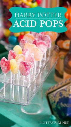 harry potter acid pops are on display in front of other candy and candies at an event