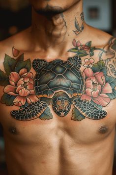 a man with tattoos on his chest has a turtle and flowers