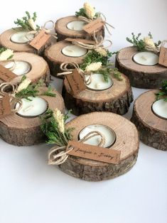 wooden slices with candles and tags tied to them