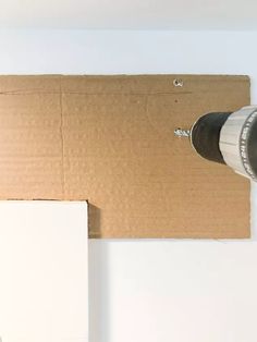 a drill that is sitting on top of a cardboard box